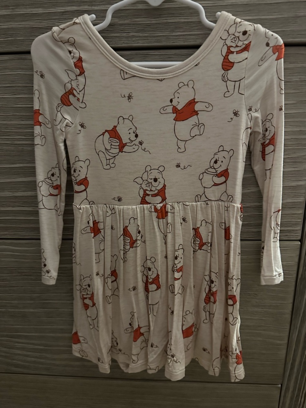 Little sleepies play Pooh dress. Washed but never worn 18-24 months